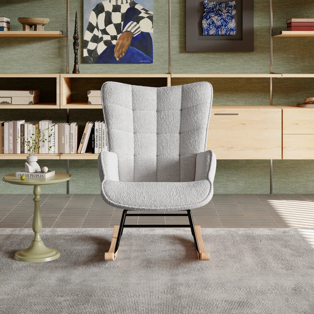 Rocking chair capitonné gris perle dans un salon