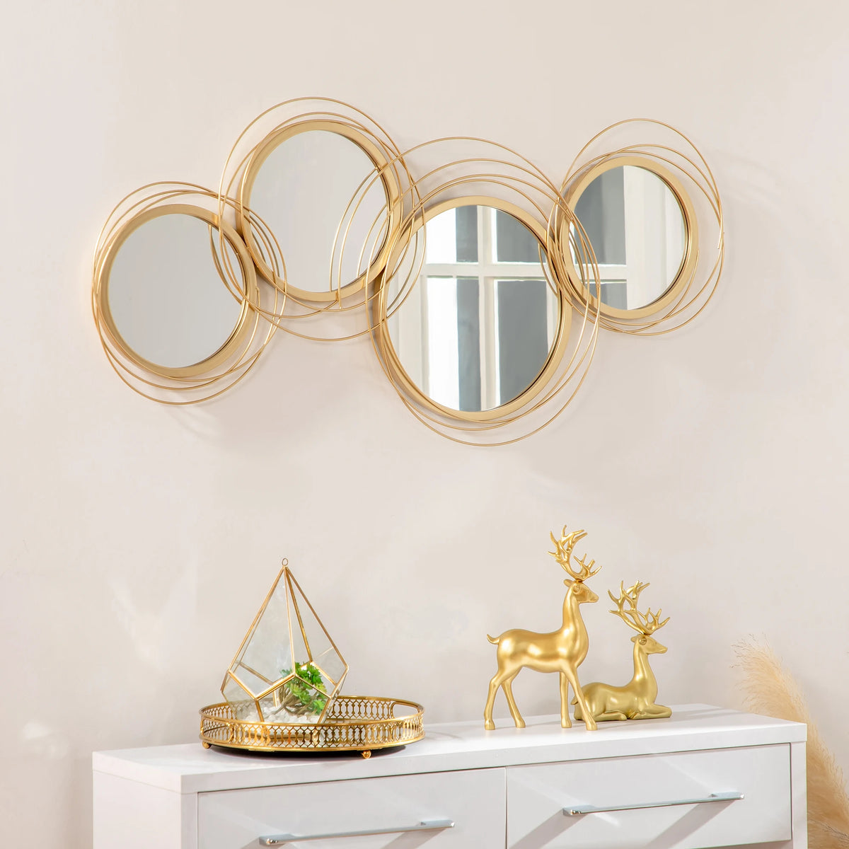 Miroir mural 4 anneaux dorés 107x56