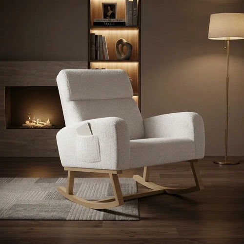 Rocking chair à dossier haut blanc près d'une cheminée
